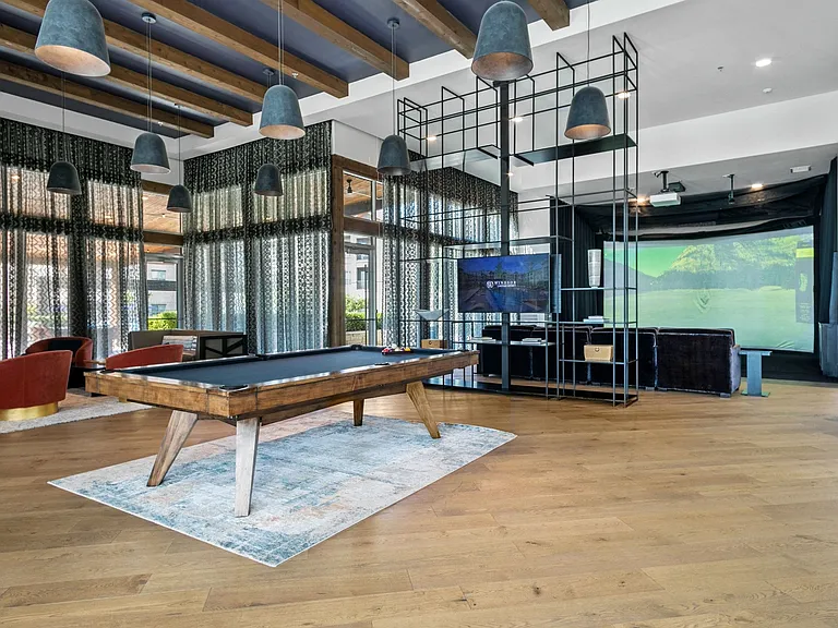 Game room with a pool table, golf simulator, and more!