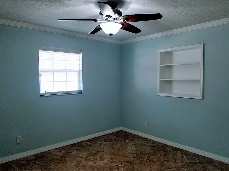 secondary bedroom with built-in