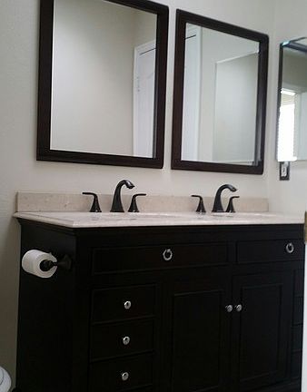Master Bath : Beautiful double vanity with granite countertop, duel mirrors and brass fittings