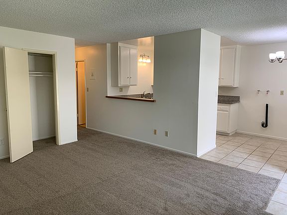 Looking from Living room to kitchen and washer / dryer hook ups.