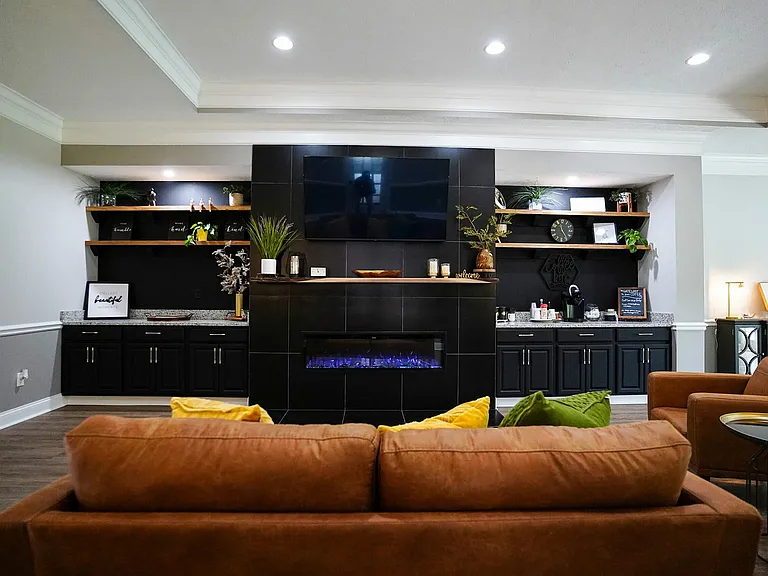 Another view of the clubhouse lounge, where you can catch the game, warm up by the fire, or just enjoy the space like it's your second living room.