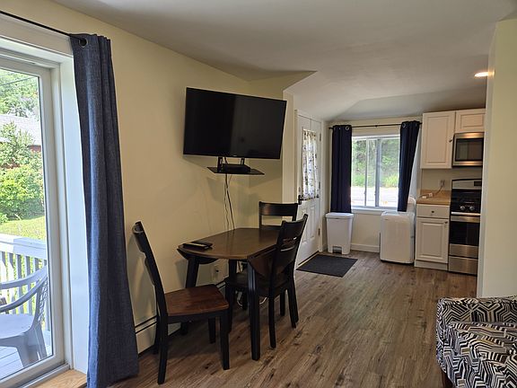 Front entrance, kitchen, and dining area