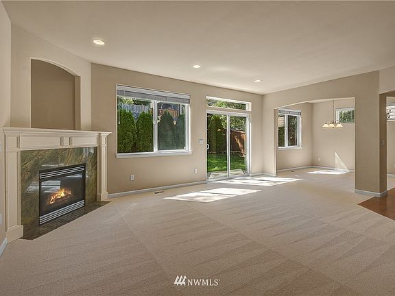You are greeted by a spacious open floor plan with lots of natural light. 
