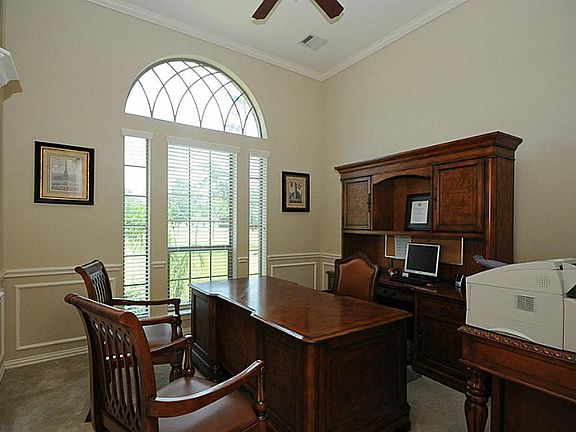 Executive Study is well appointed with North views and high ceilings. Can flex as a formal.