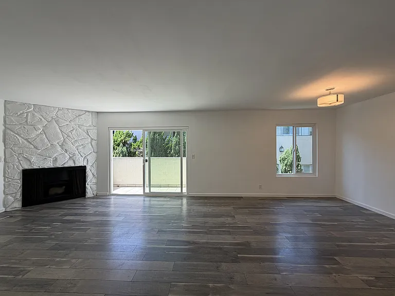 Living Room and Dining area which includes a balcony.