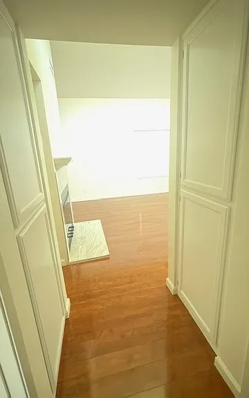 View from guest bath down the hallway into living space. Tons of storage