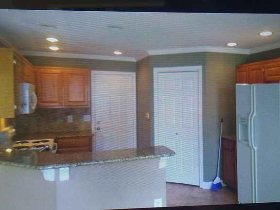 Granite counter tops, walks out to the garage.