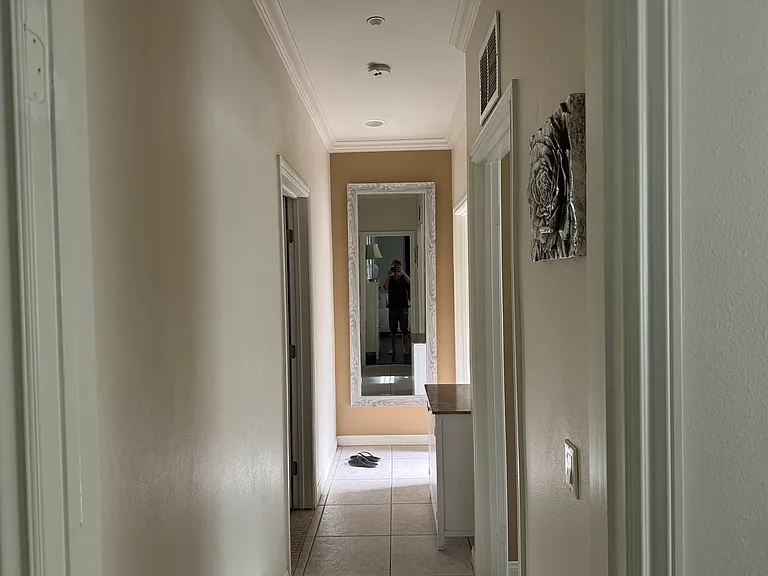 hallway to bedroom and bath
