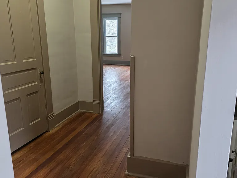Upstairs hallway looking at the walk-in closet and the master bedroom.