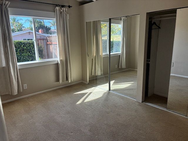 primary bedroom, fits a king bed easily with room to spare, two spacious closets