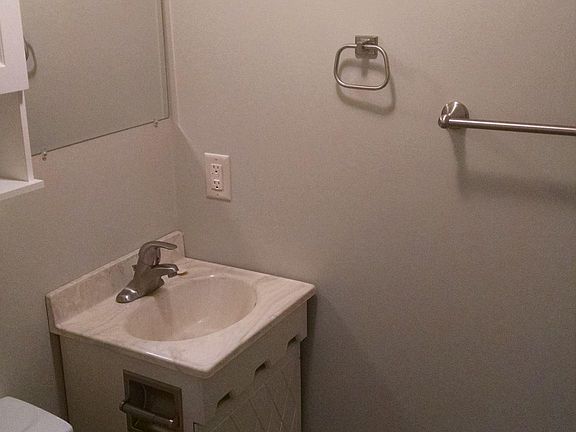 1/2 bath off of kitchen near back entry