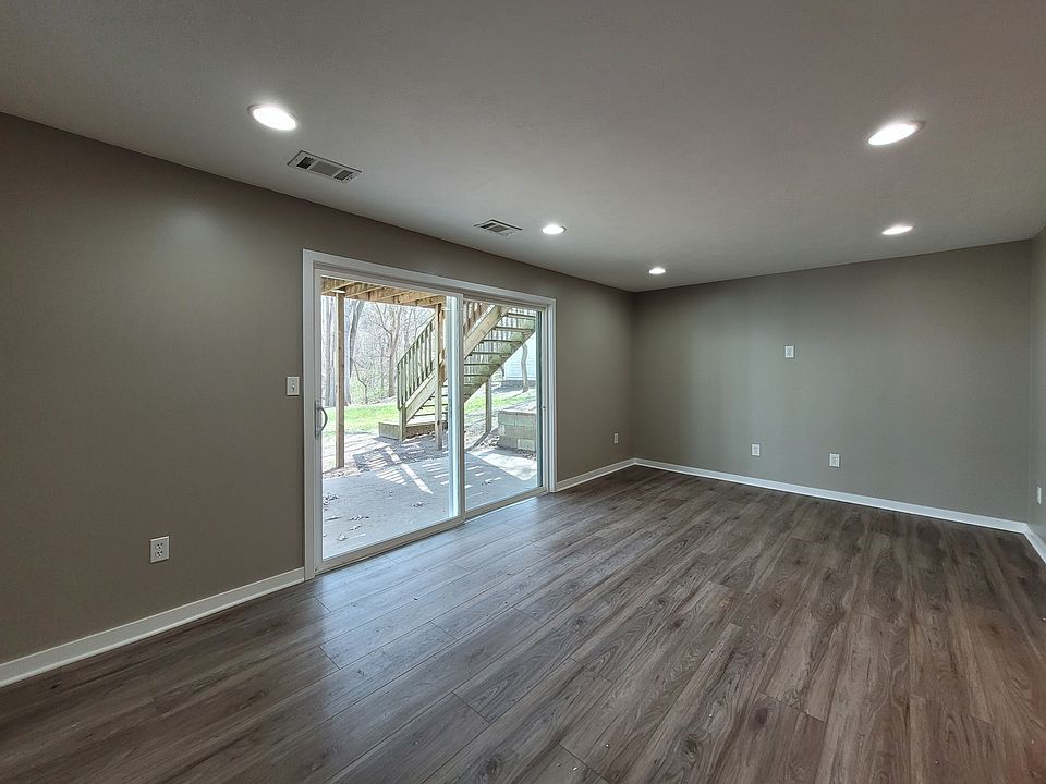 Living room with slider access to rear patio and back yard