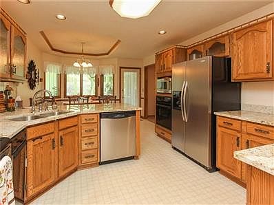 Kitchen has Recessed Lighting, Stainless Steel Appliances, Granite Countertops, Tash Compacter and 2 Ovens - 1 is a Built-in & 1 is Oven/Range Stove.