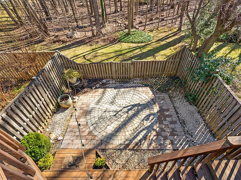 View of the garden area patio from the upper deck