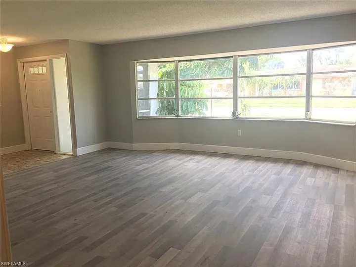 Large living room with bay windows