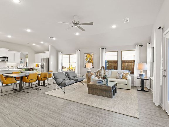 Open living space in in the Diamond home plan by Trophy Signature Homes - REPRESENTATIVE PHOTO