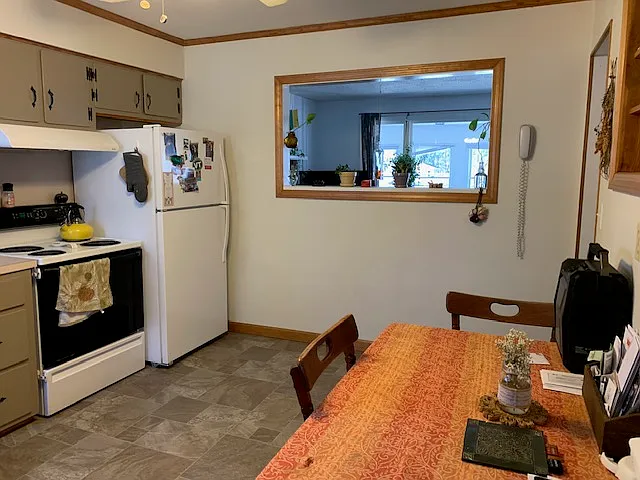 Kitchen towards peek-thru to Living