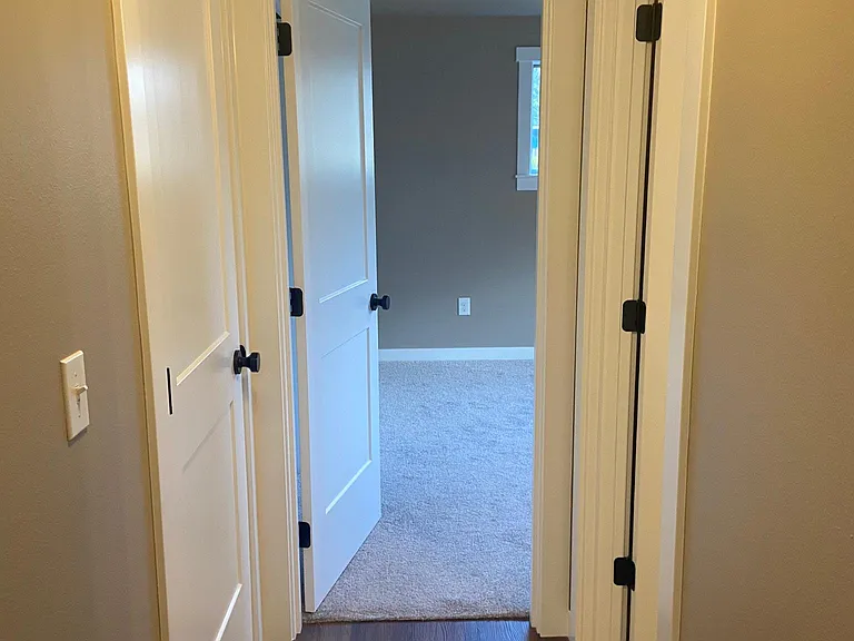 Hall from garage door to master bedroom