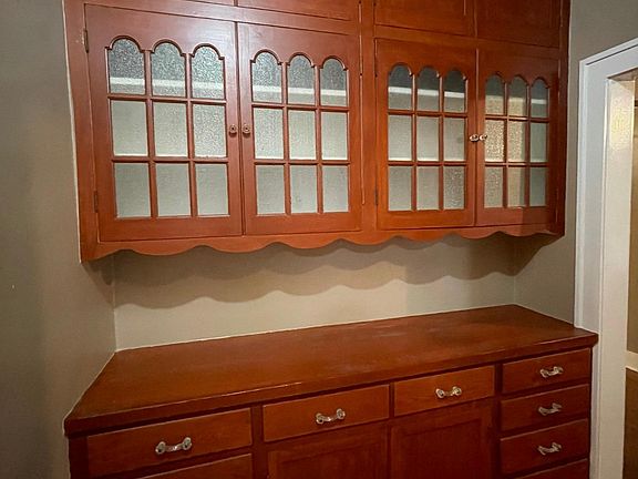 Beautiful stained built in in wood cabinets for storage