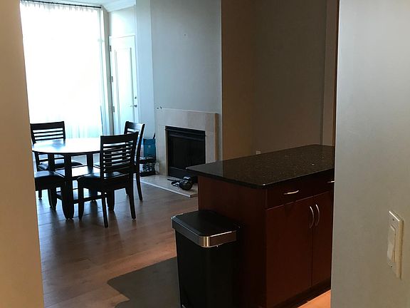 Fireplace in Kitchen keeping room, island.