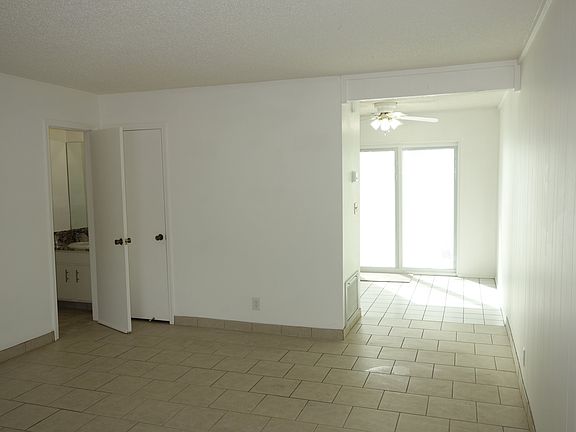 Living room view. Small hall to the kitchen on the right.