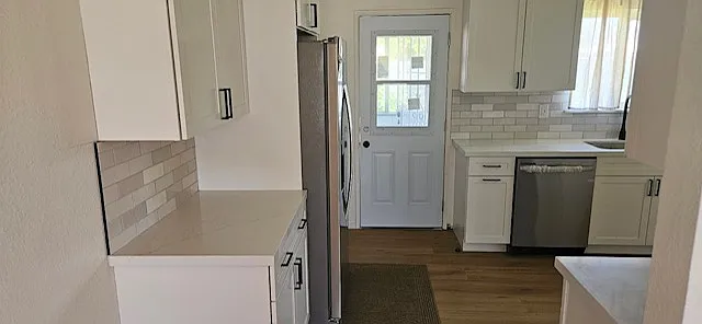 kitchen and kitchen door leading to patio