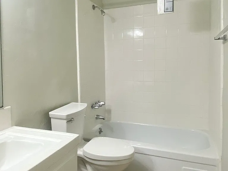 Main bathroom off of the hallway with soaker tub/shower combination