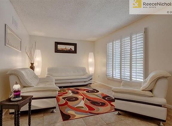 Living Room appointed with plantation shutters.