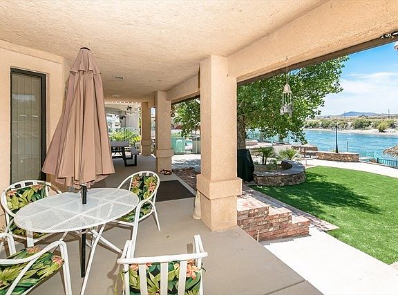 Patio over looking private beach and dock.