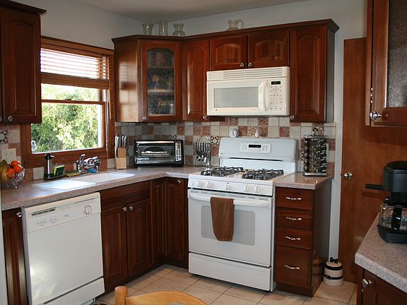 Kitchen with cherry cabinets