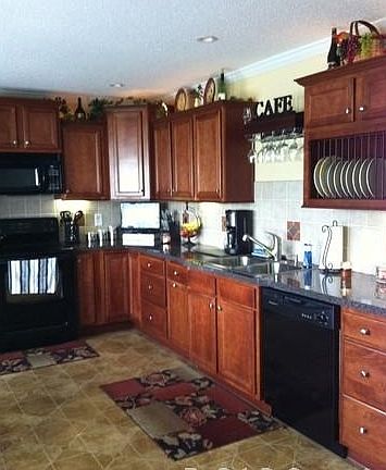 custom designed kitchen : plate rack, deep sinks, under cabinet lighting, disposal, lazy susan