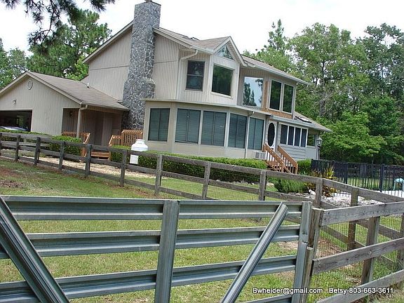 Side glassed sunroom, porch/storage/remote double car grg