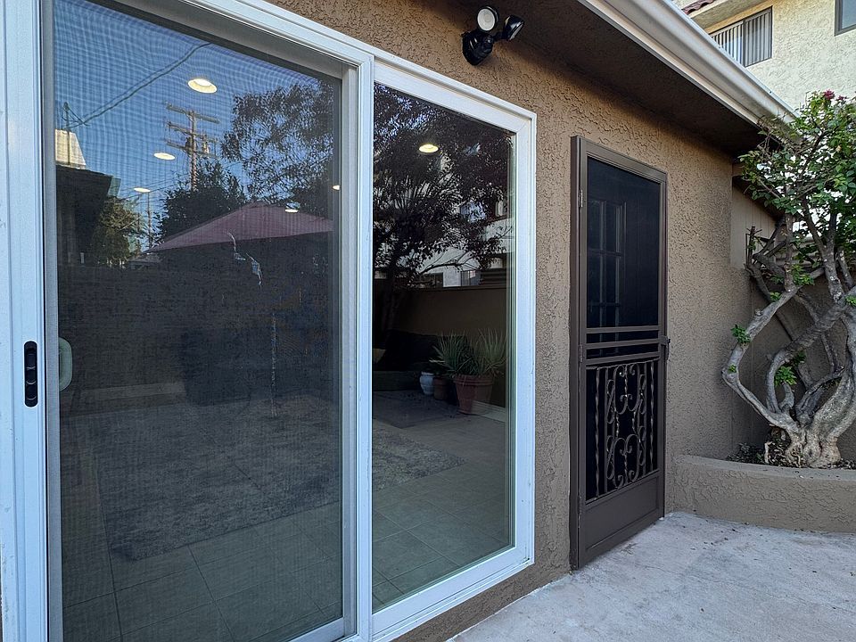 Front entry features a large sliding glass door adjacent to the front door.