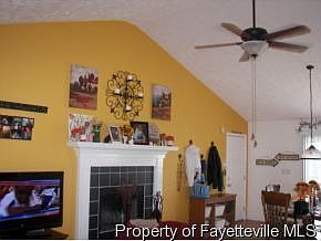 Great room w/vaulted ceiling and fireplace