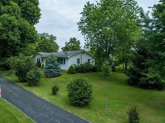 Nice wide entrance to this lovely home with a park like setting.