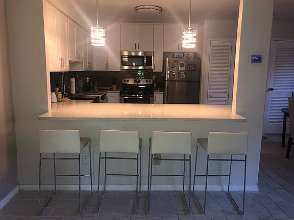 Plenty of room for countertop seating (stools not included), dimmable pendant lighting Smart Honeywell thermostat (remotely control heating and cooling with an app)