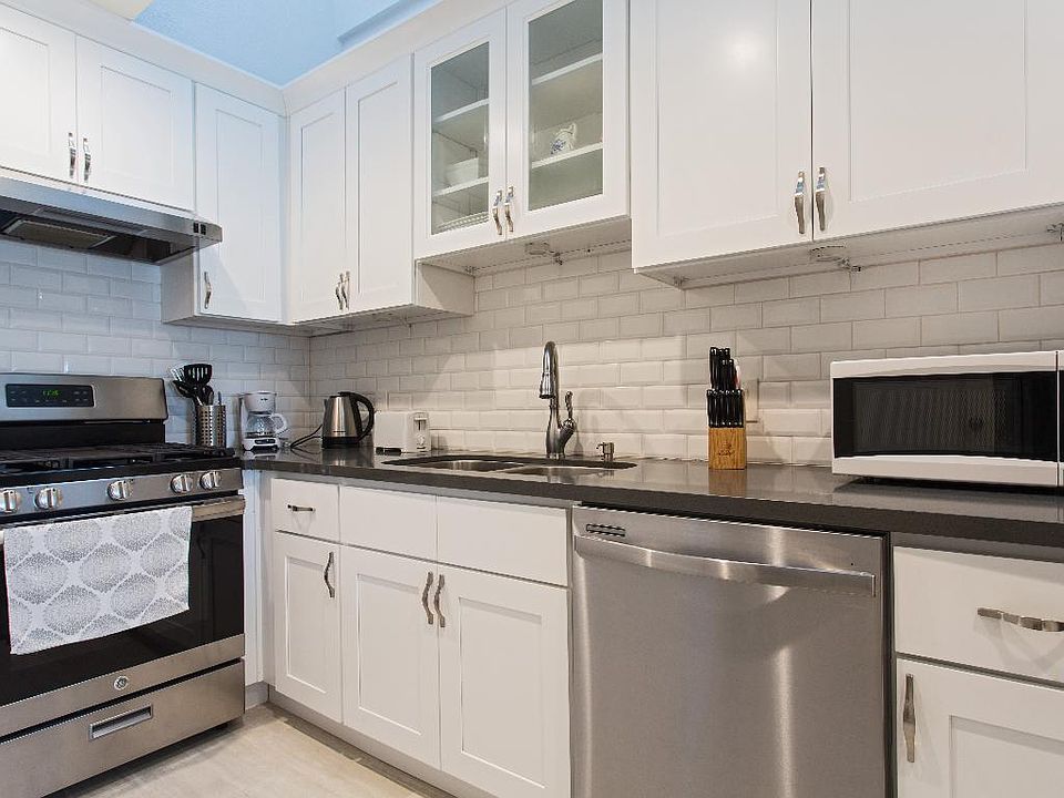 Updated kitchen with cooking utensils