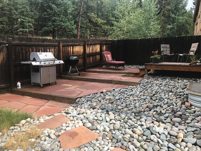 Low maintenance, fully landscaped & enclosed Back Yard