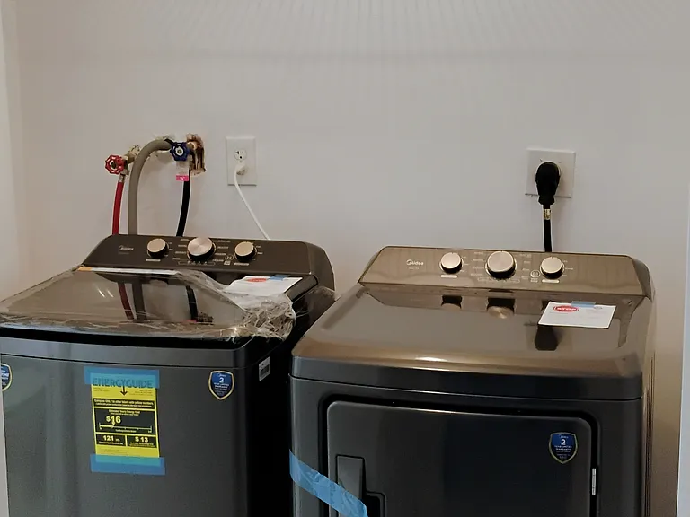 Brand new large capacity washer and dryer set.