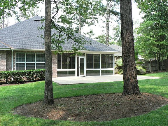 Large Screened Porch over looking shaded backyard.