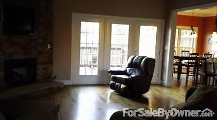 Family Room
						:
						Open family rm with wood floors and stacked stone gas fireplace opening to deck.