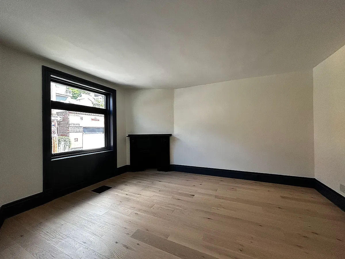 Living Room with decorative fireplace and sliding pocket doors - 843 Spring Garden Ave