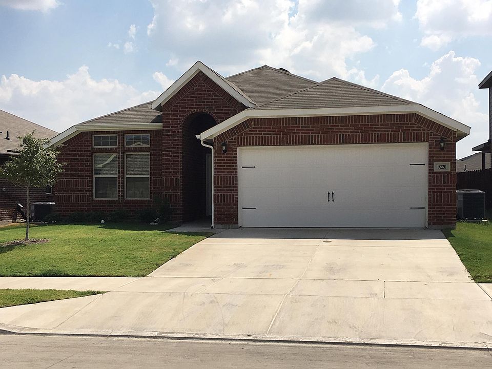 Gorgeous premium elevation with super-high porch, and raised ceiling in front-facing room!