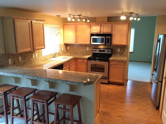 Open Kitchen with eating bar on the granite countertops