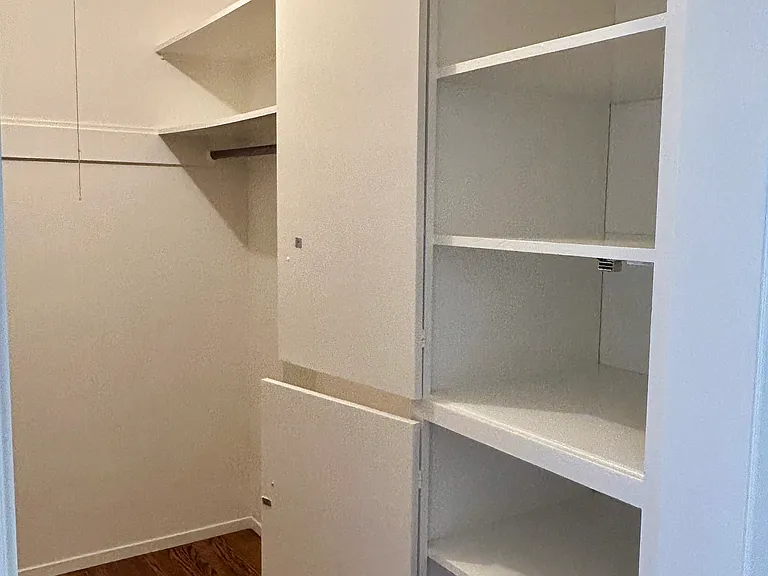 Built-in cabinets & shelves in the walk-in closet