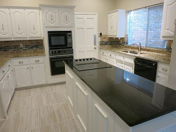 New granite and stylish procelain flooring. New stove, sink