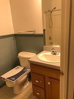 Upstairs bath with tub and shower.