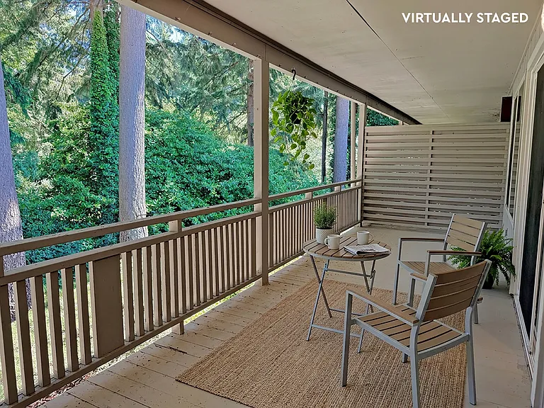 Spacious patio with a gorgeous view. There is a public park behind the property line.