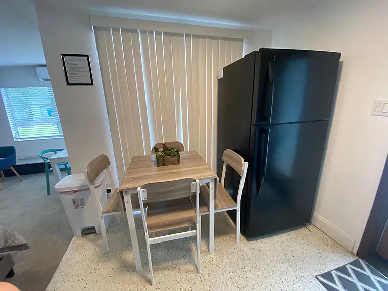 Enjoy a cozy dining space with equipped kitchen and refrigerator.
