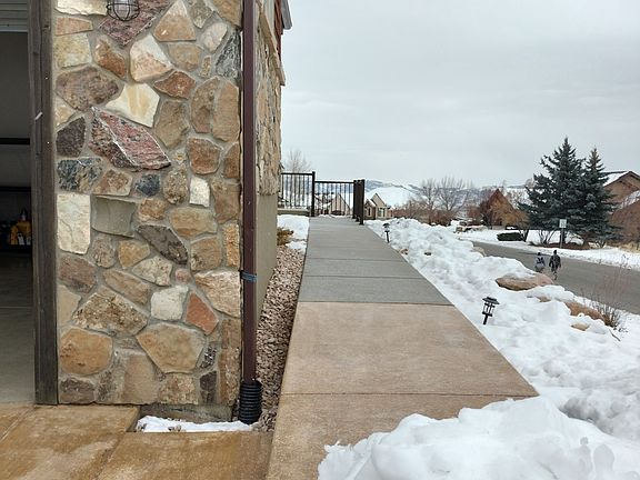 Spacious living room in a beautiful open-floor-plan home. Enjoy unobstructed mountain views, vibrant wildlife from your couch, and peace of mind with security cameras. Zero-scape yard ensures low maintenance and natural beauty year-round.